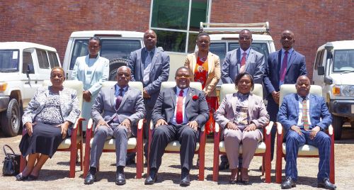 A group photo of the Hon Minister, officials from the Ministry and MANEB Management team